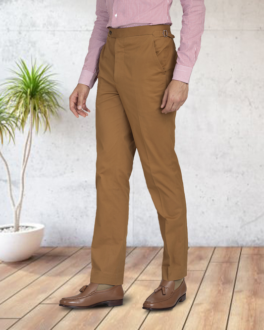 Model wearing custom Genoa Chino pants for men by Luxire in copper