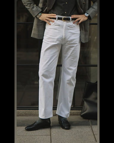 Model wearing mens heavy twill jeans by Luxire in white