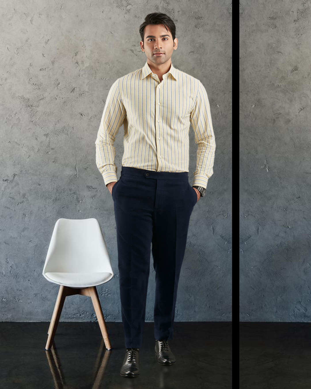 Front of model wearing the custom oxford shirt for men by Luxire in pale yellow with indigo and white stripes