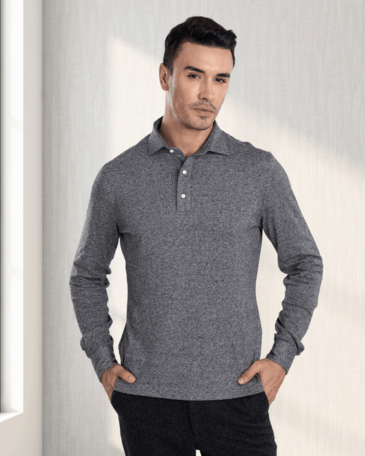 Model wearing the custom oxford polo shirt for men by Luxire in dark light grey hands at side