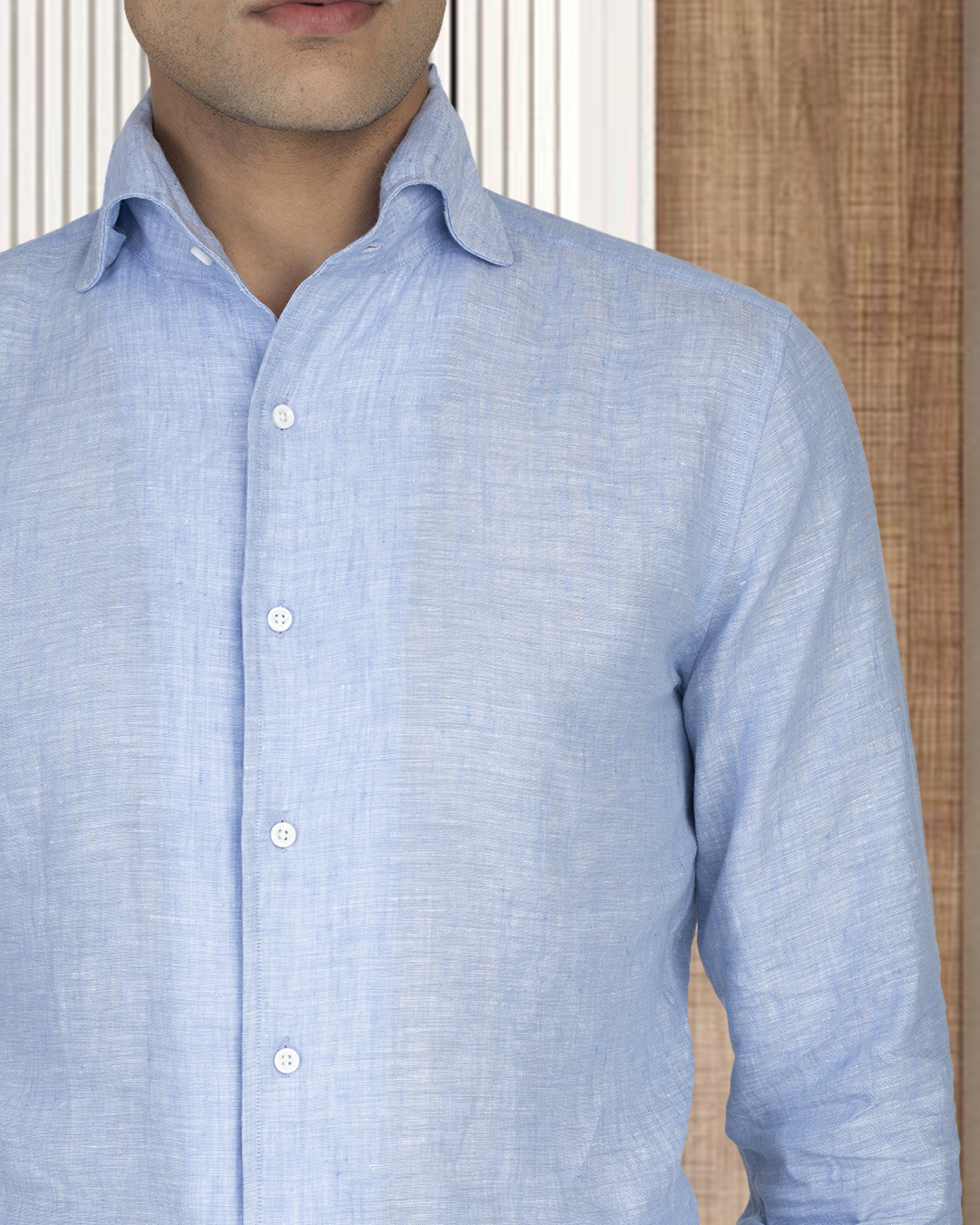 Model wearing the custom linen shirt for men in light blue chambray by Luxire Clothing 3