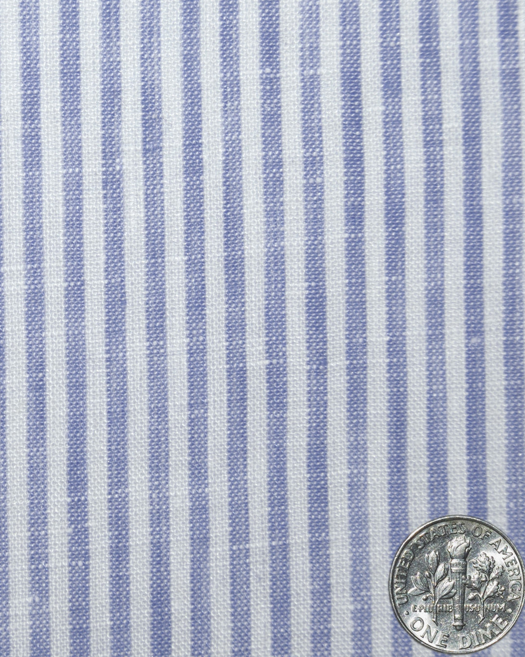 Close up of custom linen shirt for men in blue and white dress stripes by Luxire Clothing