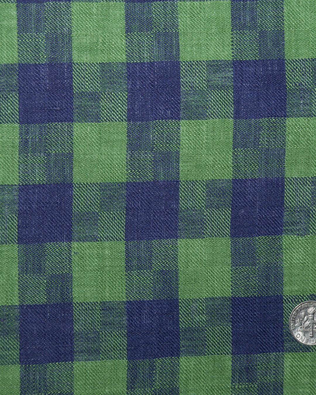 Close up view of custom linen shirt for men in indigo blue green madras gingham