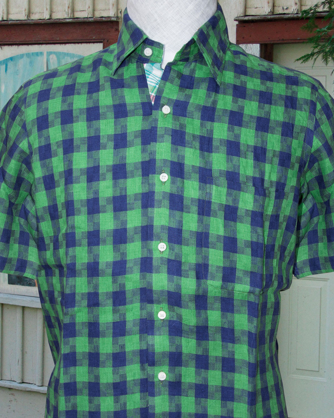 Front model view of custom linen shirt for men in indigo blue green madras gingham