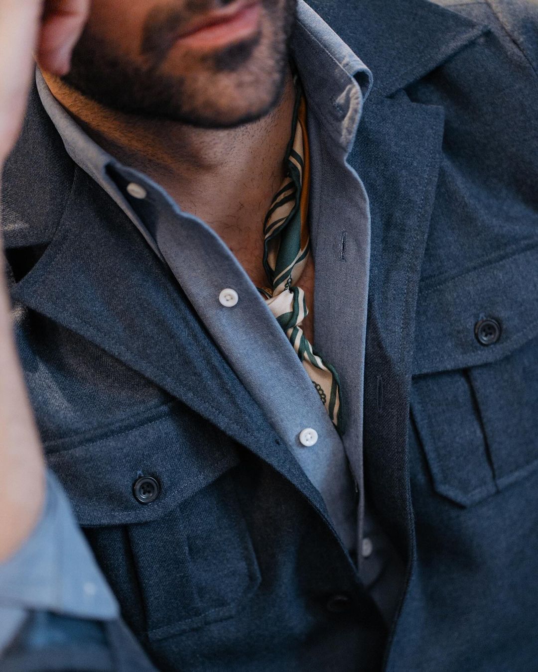 Close up of model wearing the wool flannel shirt jacket for men by Luxire in navy blue 4