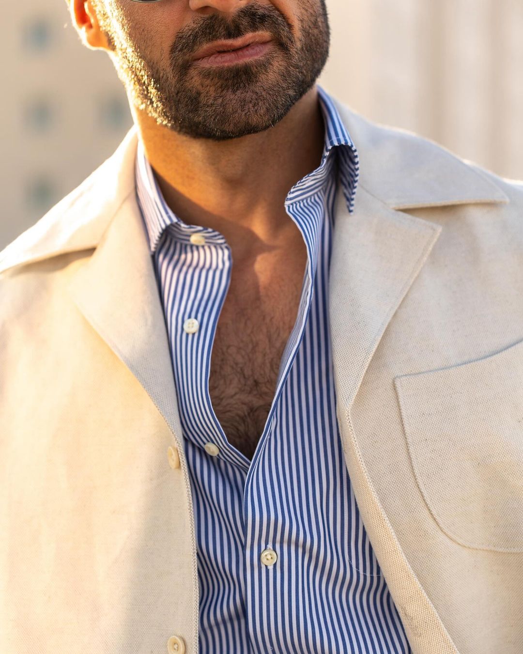 Close up of model outside wearing the linen shirt jacket for men by Luxire in cream