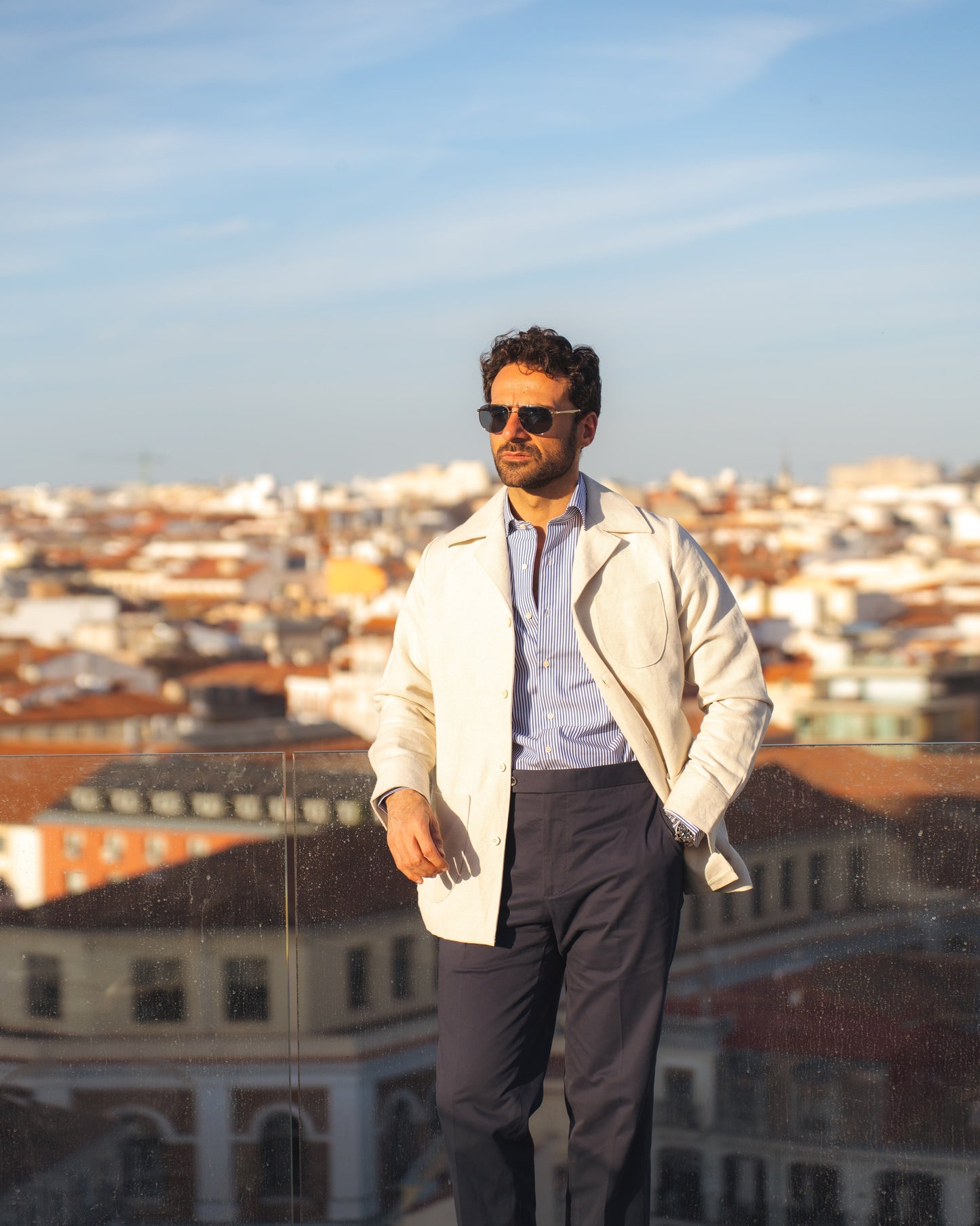 Model outside wearing the linen shirt jacket for men by Luxire in cream