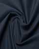 Close up view of custom Genoa Chino pants for men by Luxire in dark teal blue