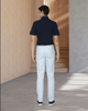 Back view of model wearing custom Genoa Chino pants for men by Luxire in powder blue