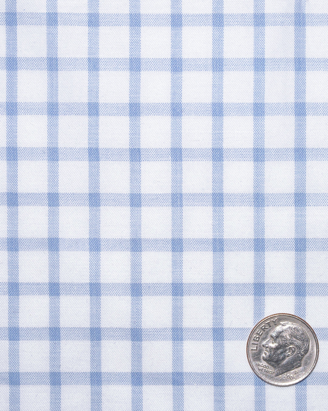Closeup view of custom check shirts for men by Luxire light blue plaid