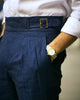 Male model wearing custom linen Gurkha pants for men by Luxire in dark indigo