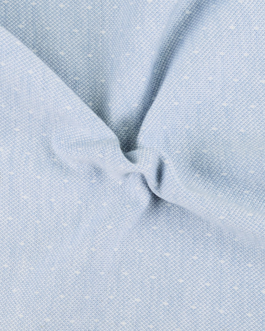 Close up fabric of the custom oxford polo shirt for men by Luxire in light blue with dots