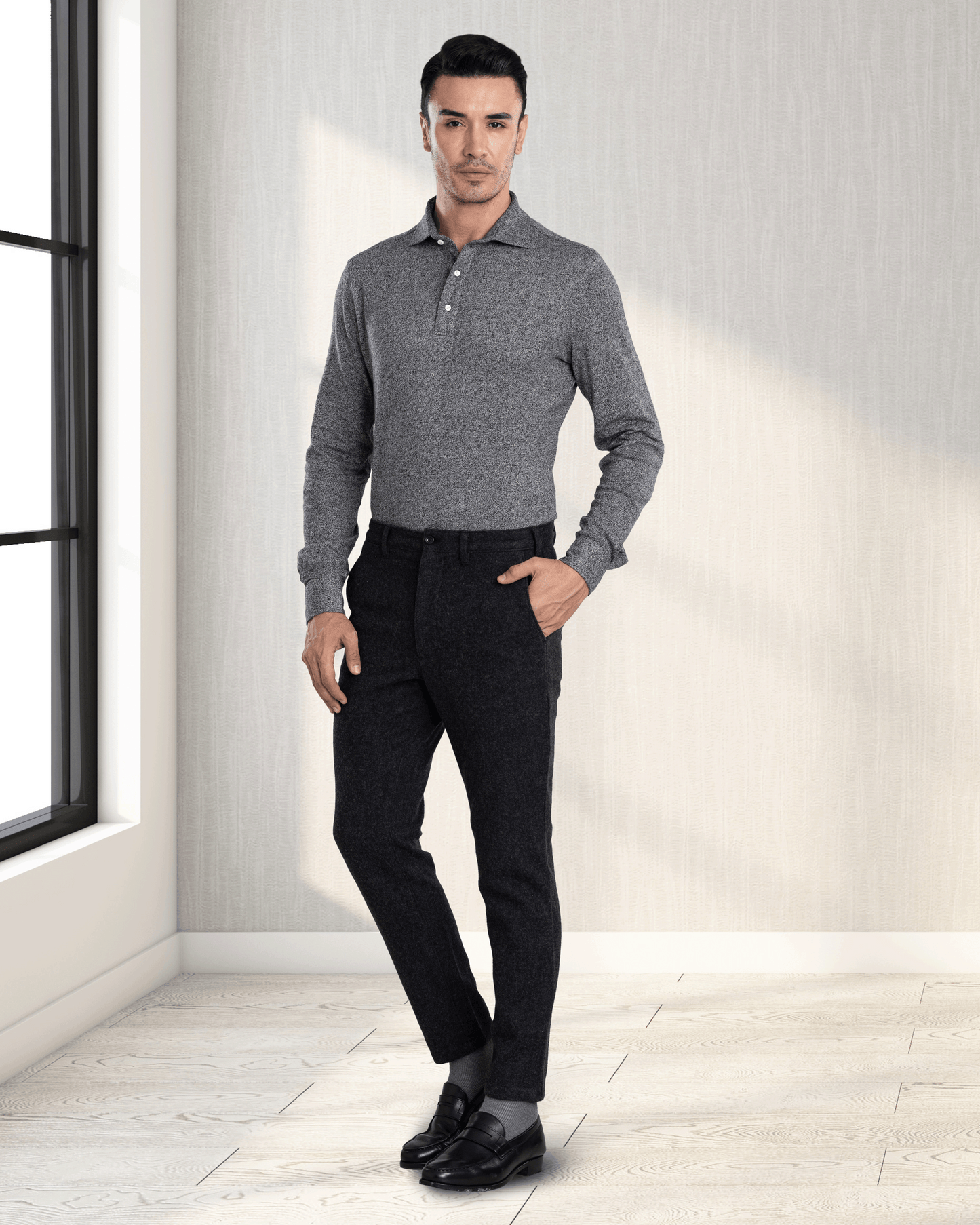 Model wearing the custom oxford polo shirt for men by Luxire in dark light grey hand in pocket