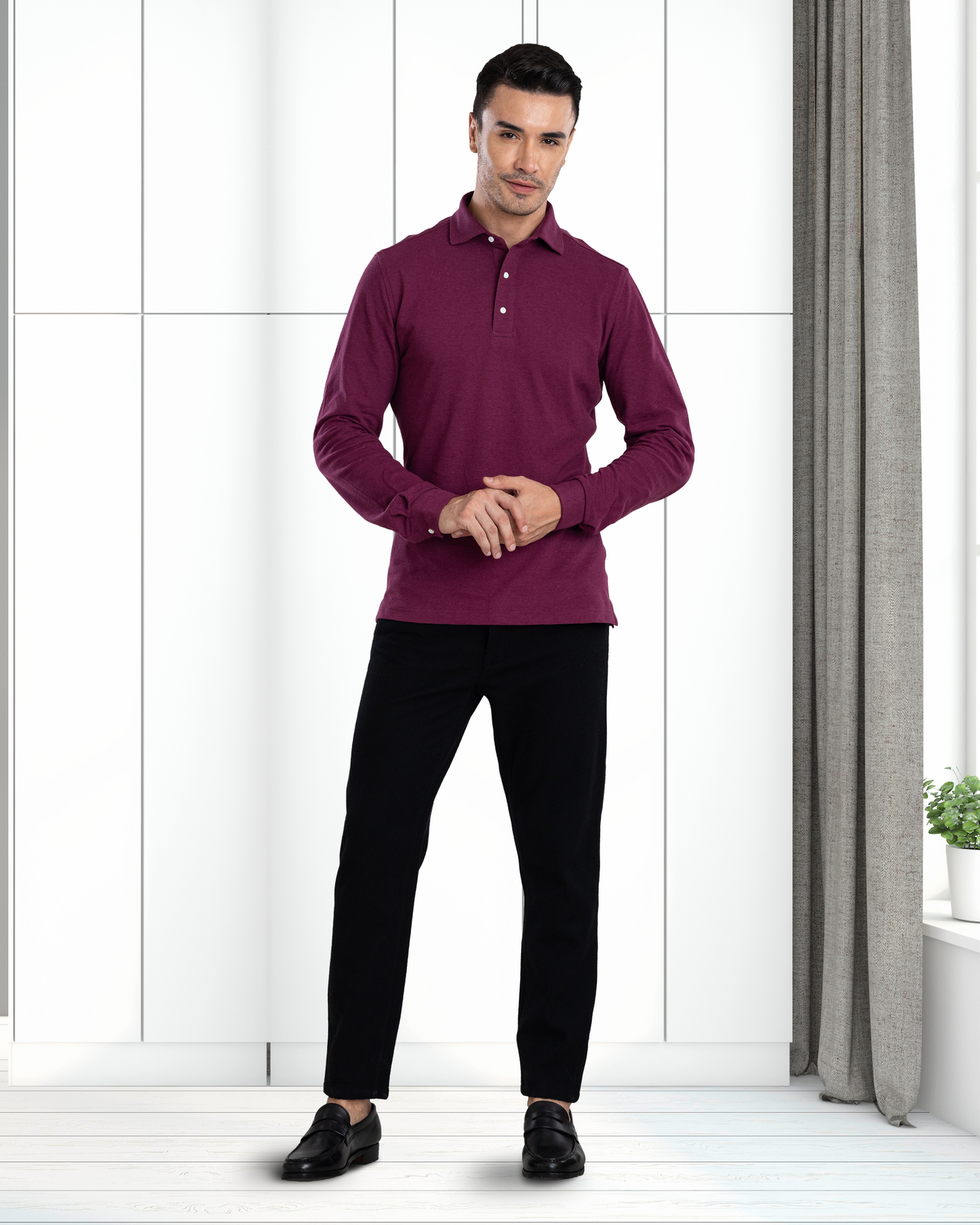 Model wearing the custom oxford polo shirt for men by Luxire in purple hands together