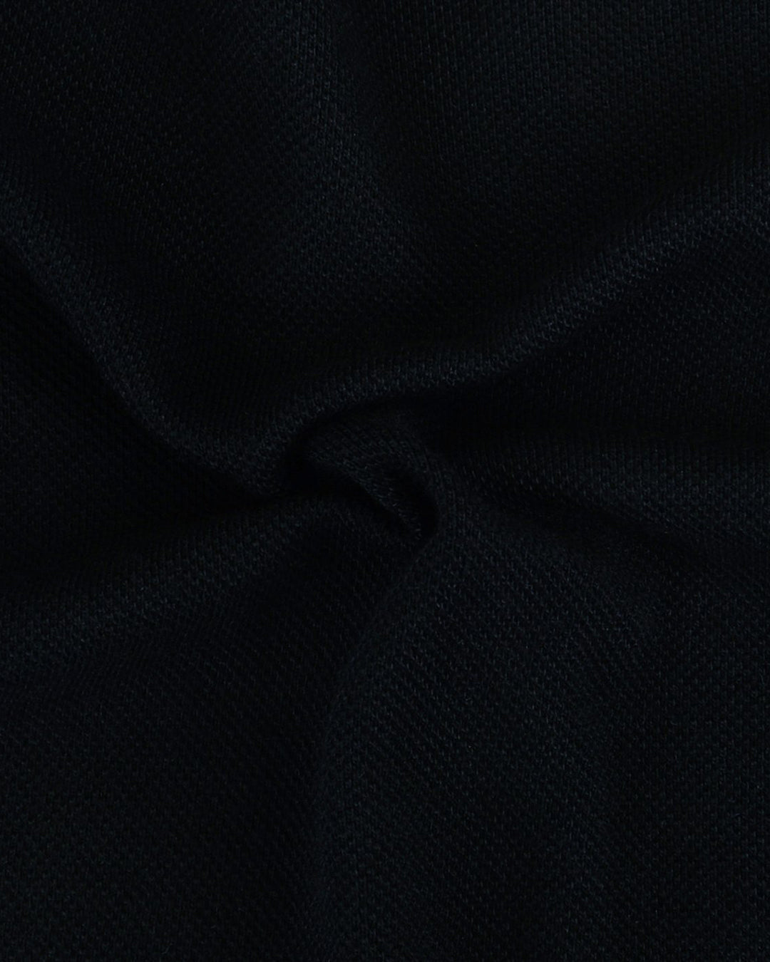 Close up of the custom oxford polo shirt for men by Luxire in soft black