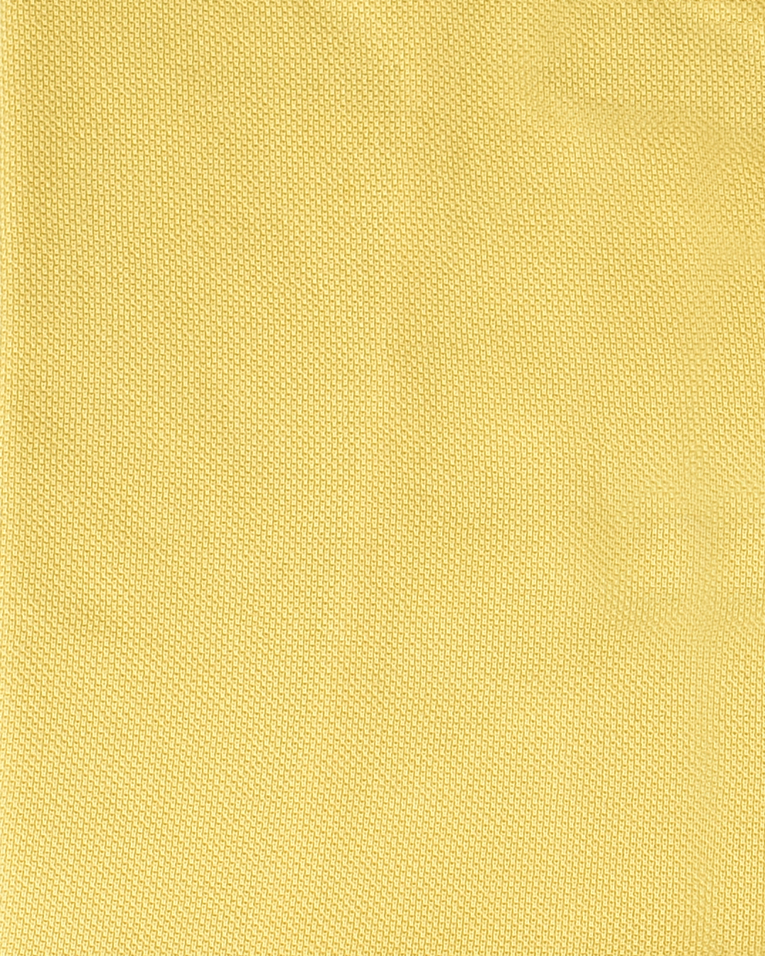 Close up of the custom oxford polo shirt for men by Luxire in light yellow