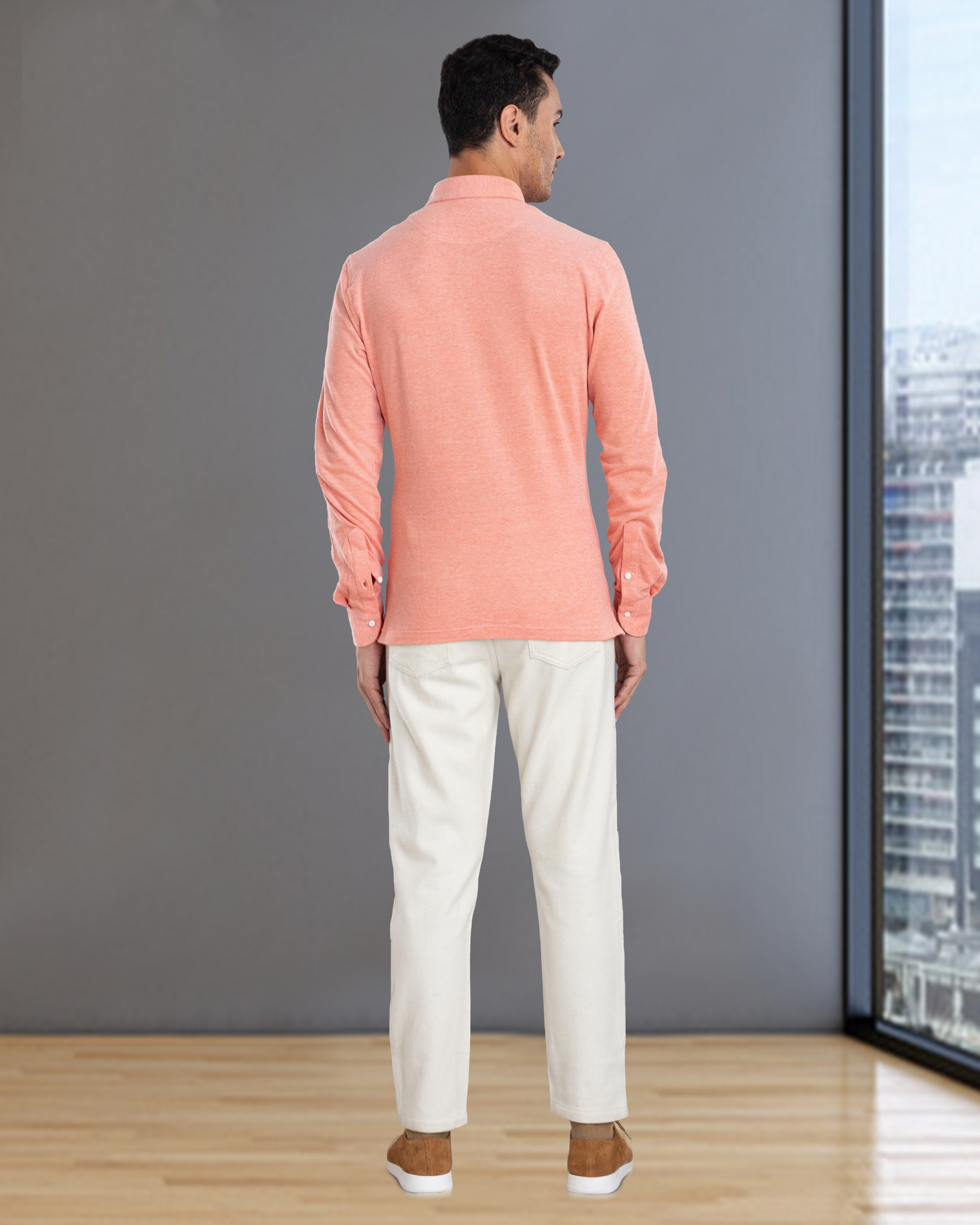 Back of model wearing mens wool jeans by Luxire in cream