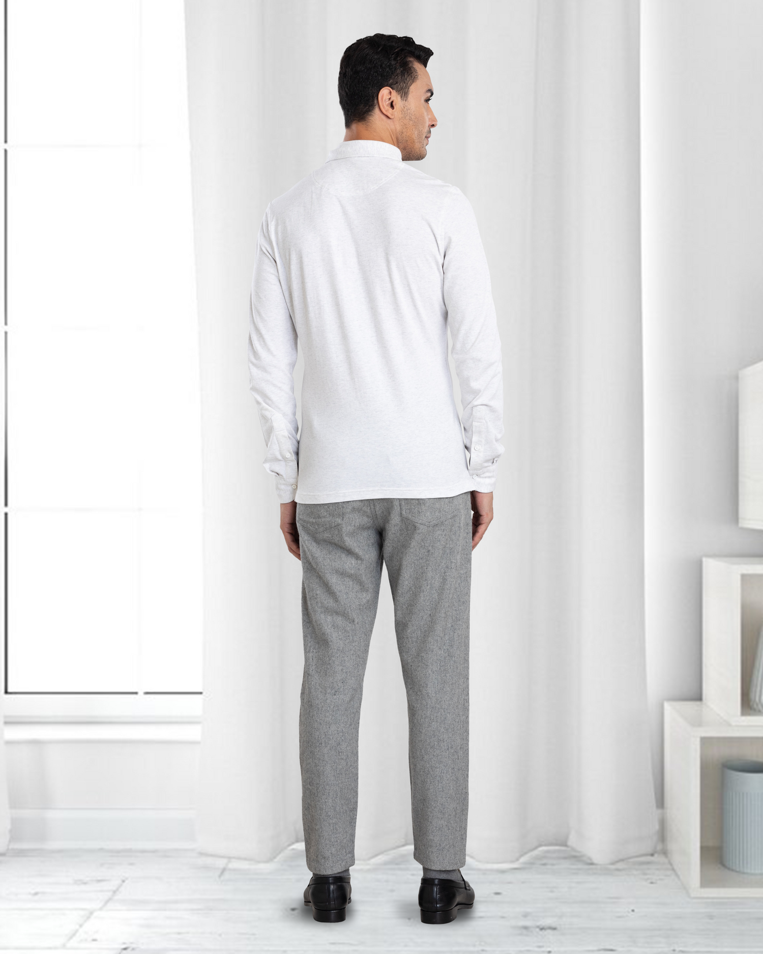 Back of model wearing mens wool jeans by Luxire in grey