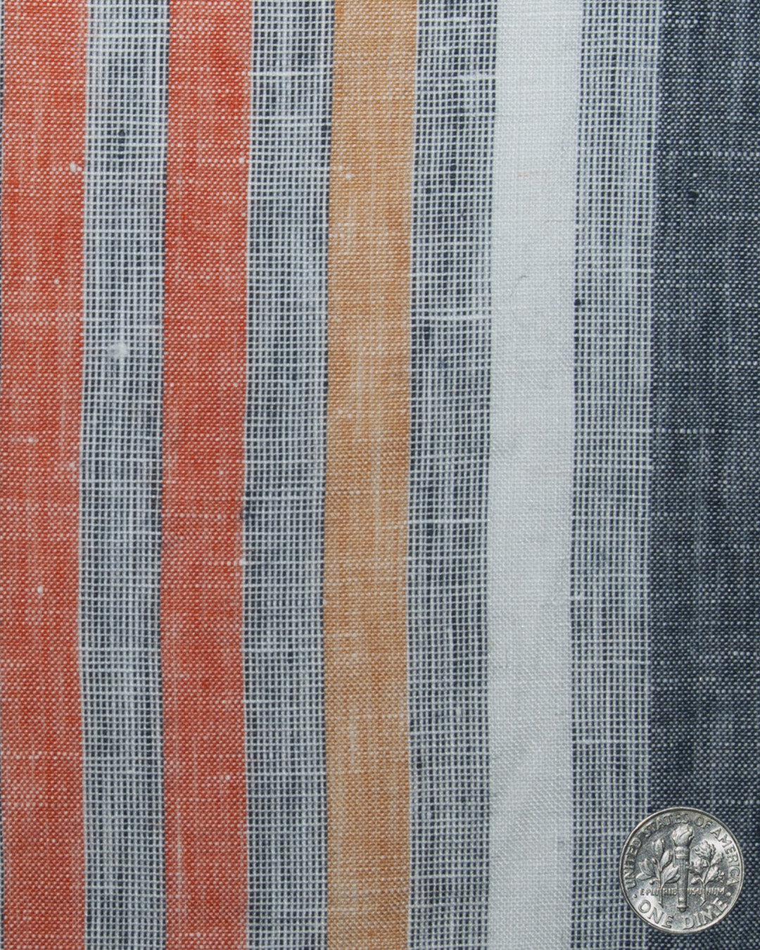 Close up of custom linen shirt for men in orange red white stripes by Luxire Clothing