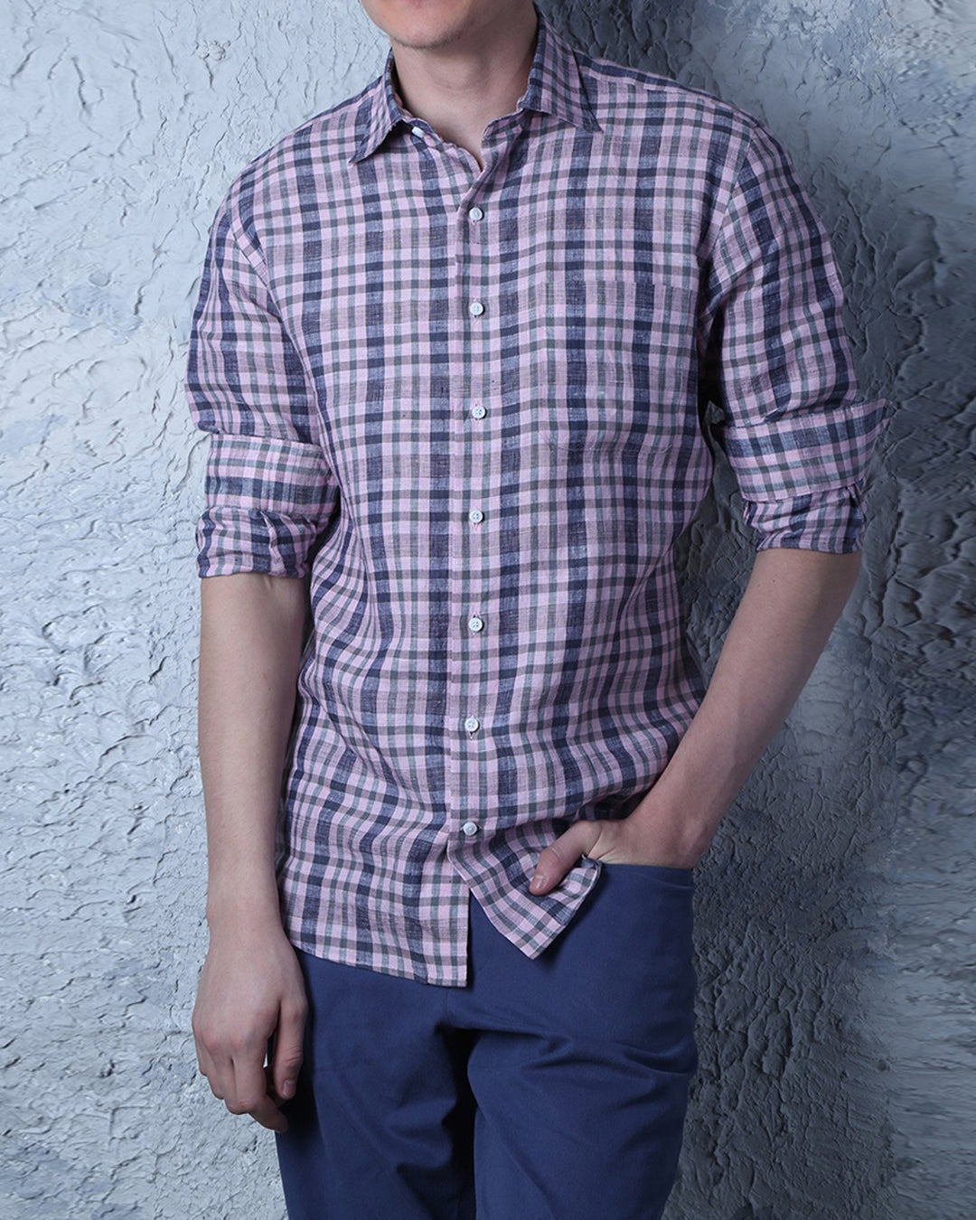 Model wearing custom linen shirt for men by Luxire in pink and navy checkered