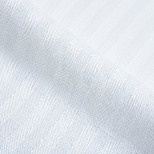 Close up of the custom linen shirt for men in white with wide stripes by Luxire Clothing