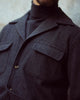 Close uo of model wearing the recycled wool shirt jacket for men by Luxire in charcoal grey