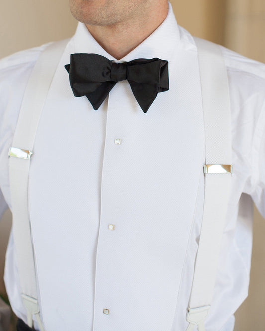 Model wearing mens tuxedo shirt by Luxire in white with black bow tie